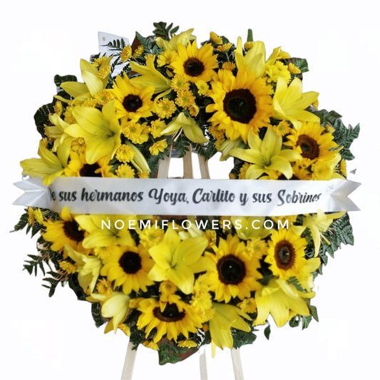 Corona Fúnebre Sol de Despedida - Floristería Noemi Flowers