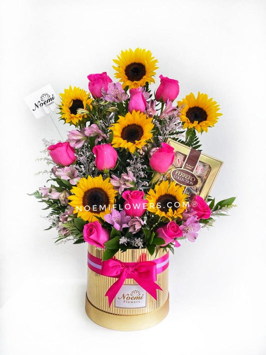 Dulce Sorpresa confeccionado de girasoles, rosas, astromelias, solidago y helechos acompañado de Ferrero Rocher collections - Floristería Noemi Flowers