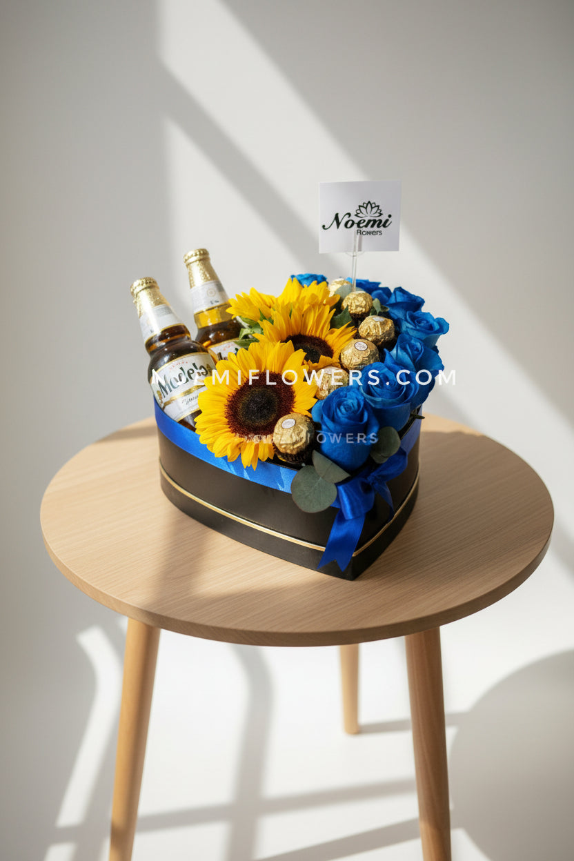 Caja regalo con girasoles rosas azules chocolates y cervezas - Floristería Noemi Flowers