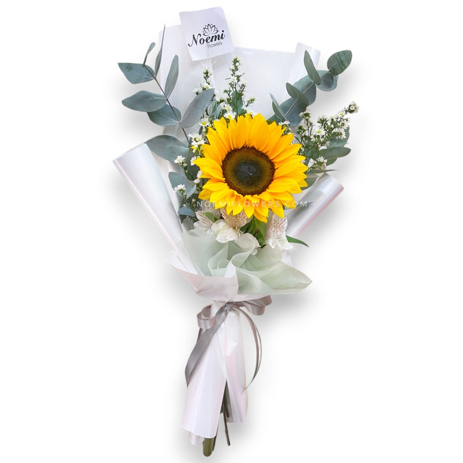 Girasol, astromelias y un toque de eucalipto en papel decorativo - Floristería Noemi Flowers