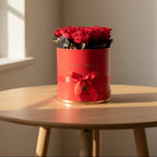 9 rosas naturales preservadas en caja redonda - Floristería Noemi Flowers