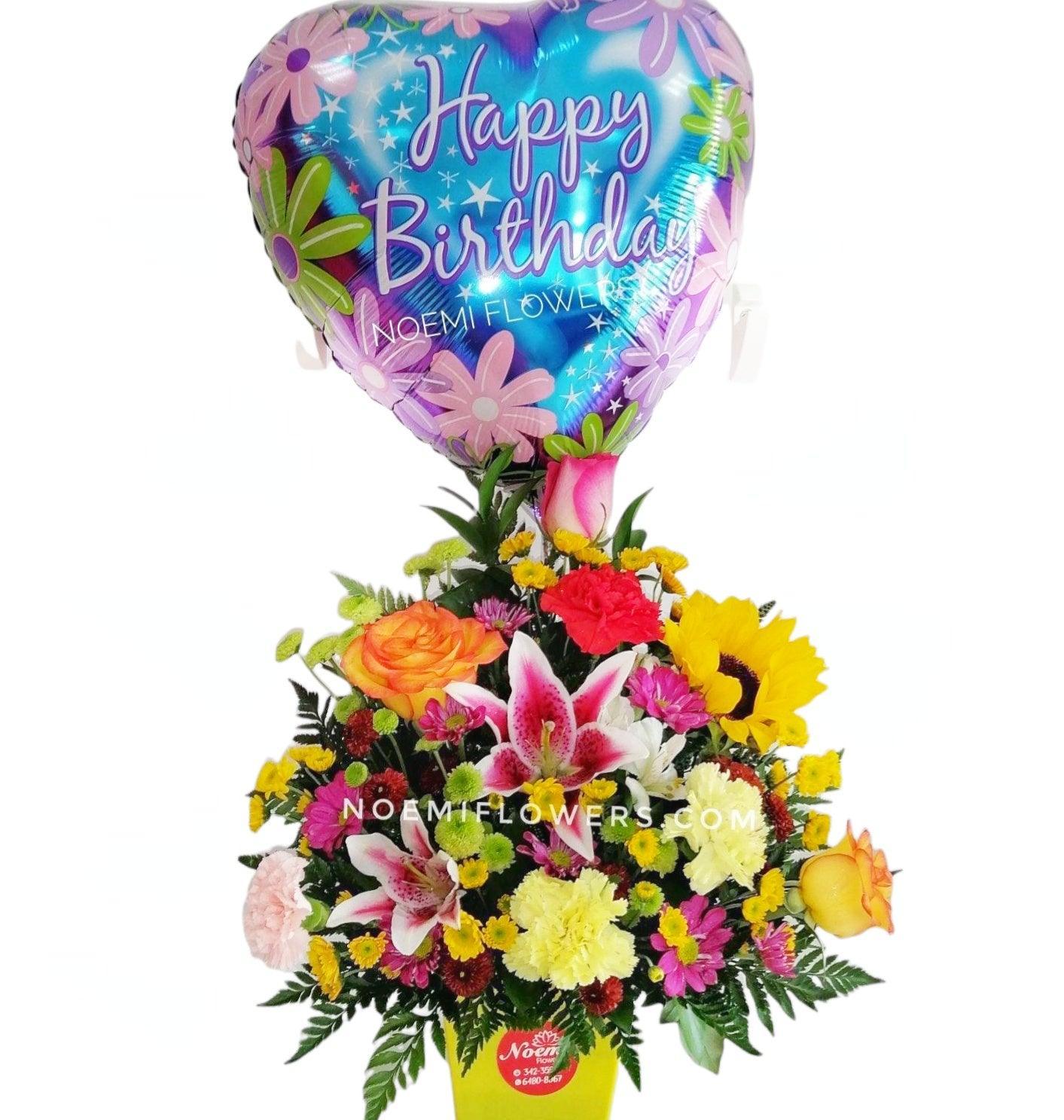 ParaÍso Floral confeccionado con rosas, lirios, claveles, girasol  y globo de 18" - Floristería Noemi Flowers