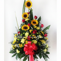 Pedestal confeccionado con rosas, girasoles, margaritas, claveles- Floristería Noemi Flowers. 