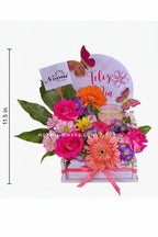 Arreglo con rosas, gereberas y una vela - Floristería Noemi Flowers