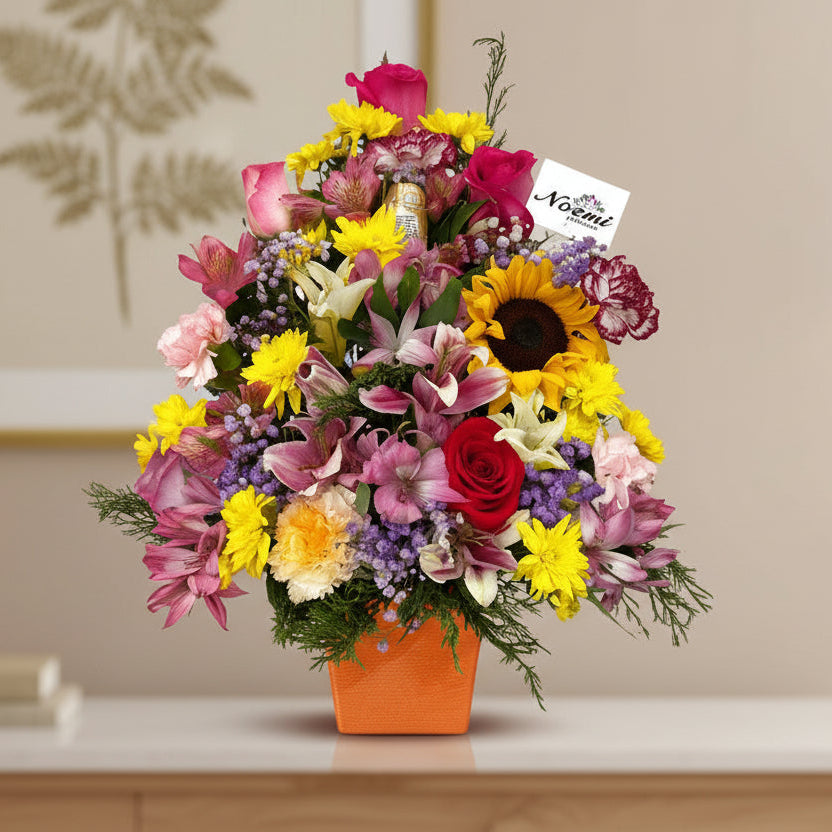 Un arreglo muy colorido y fragante confeccionado con flores de primavera en variados colores según disponibilidad y temporada. Incluye Ferrero Rocher de 3 unidades.

Altura aproximada 20 pulgadas.- Floristería Noemi Flowers